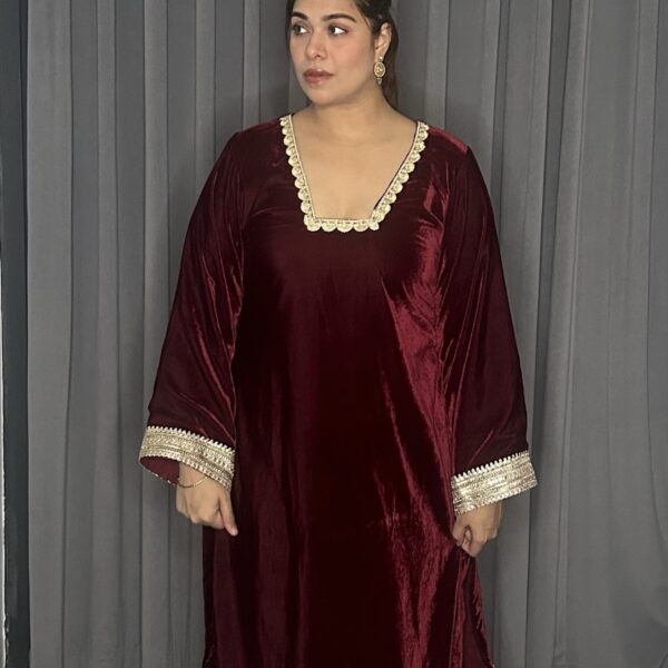 Maroon Velvet kurta set.